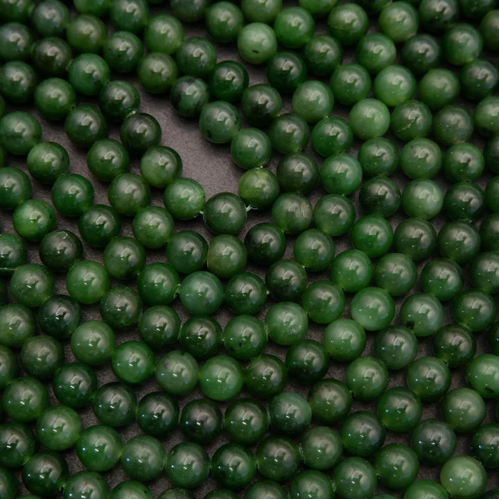 Close-up of green beads on a dark background