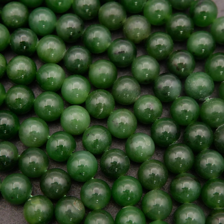 Close-up of green beads on a dark background