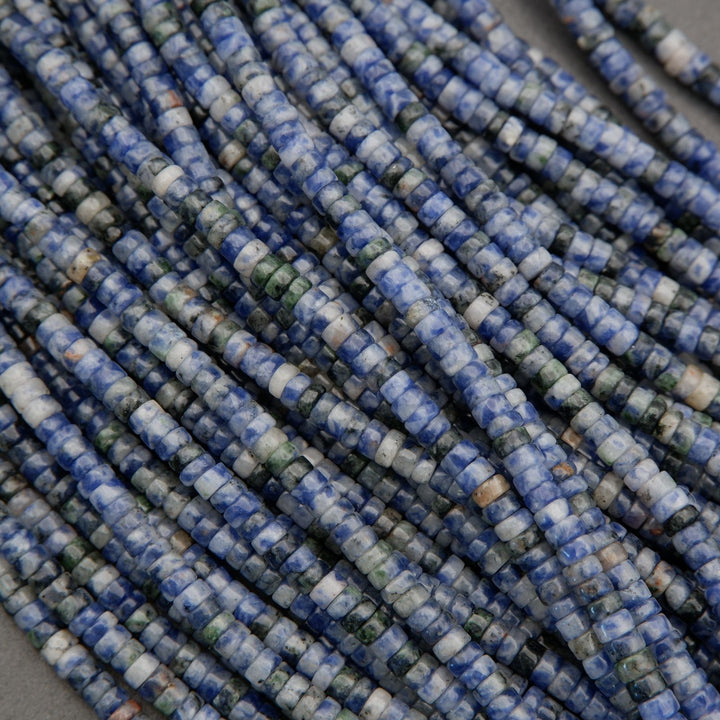 Bundle of sodalite heishi bead strands with mixed blue and white coloration.