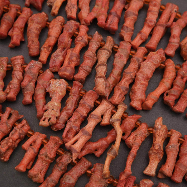 Close-up of dried red chili peppers on a dark surface
