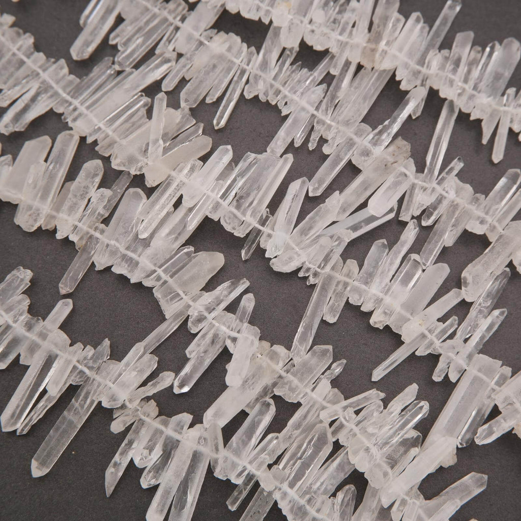 Close-up of clear crystal-like structures on a dark background