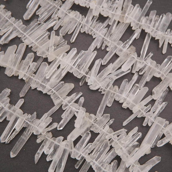 Close-up of clear crystal-like structures on a dark background