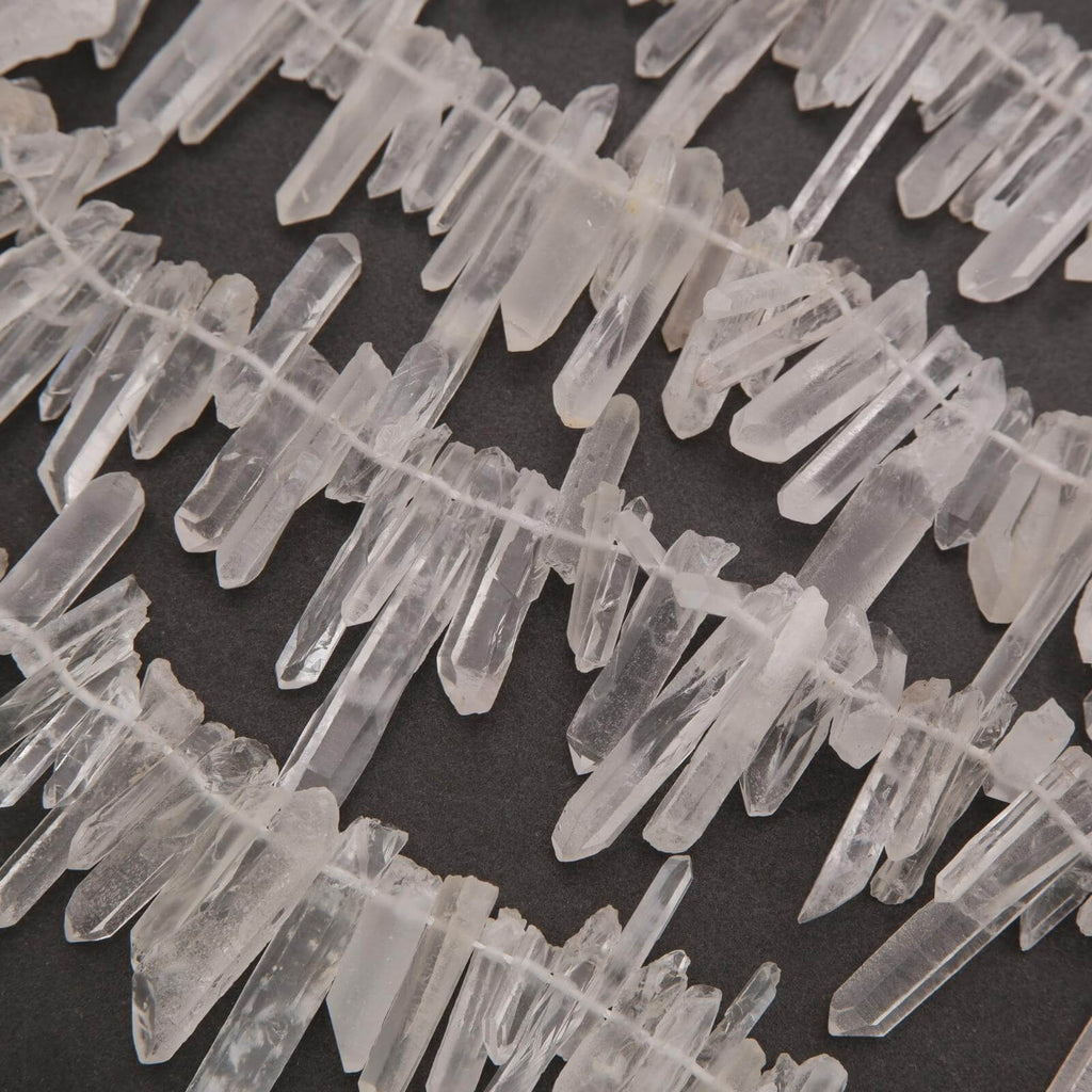 Close-up of clear crystal formations on a dark background
