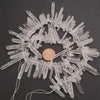 Decorative wreath made of clear plastic sticks on a dark background