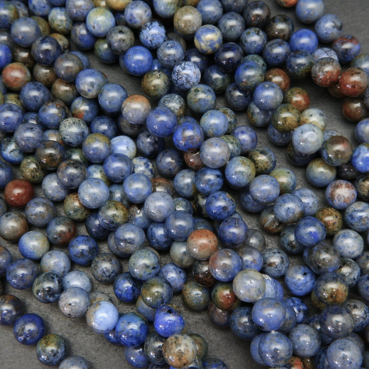 Mixed blue and red sunset dumortierite beads.