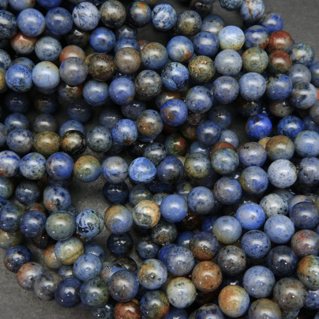 Mixed blue and red sunset dumortierite beads.