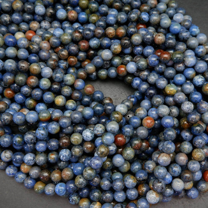 Mixed blue and red sunset dumortierite beads.