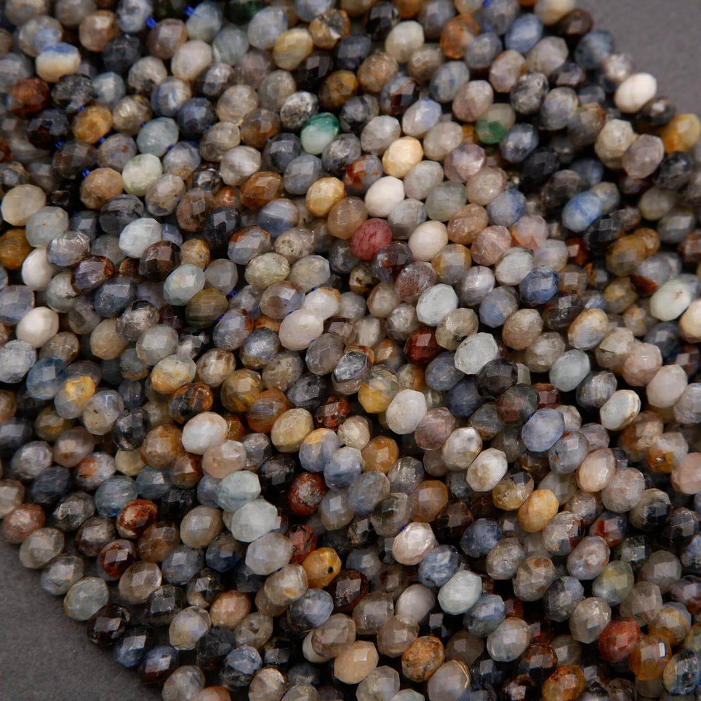 Close-up of multicolored small stones on a gray background