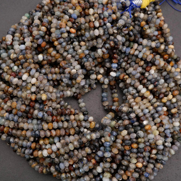 String of multicolored beads on a gray background