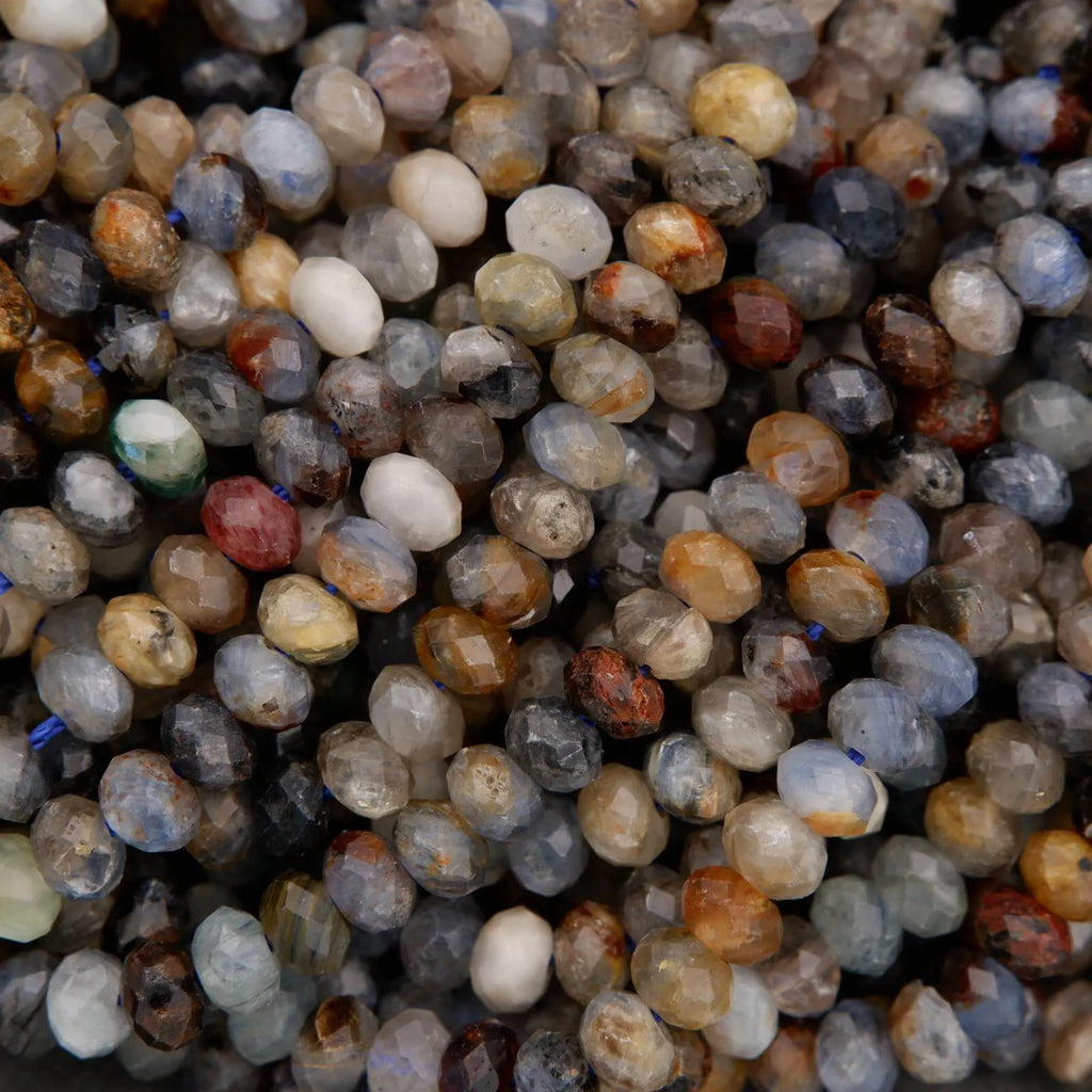 Close-up of a pile of multicolored kyanite beads.