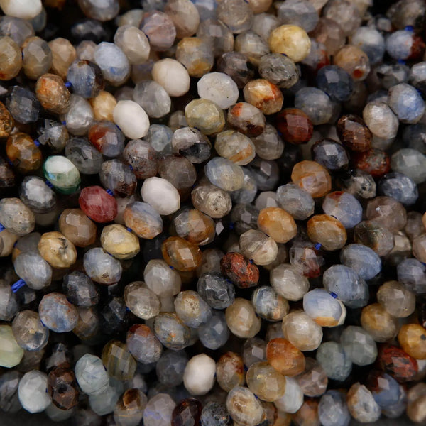 Close-up of a pile of multicolored kyanite beads.