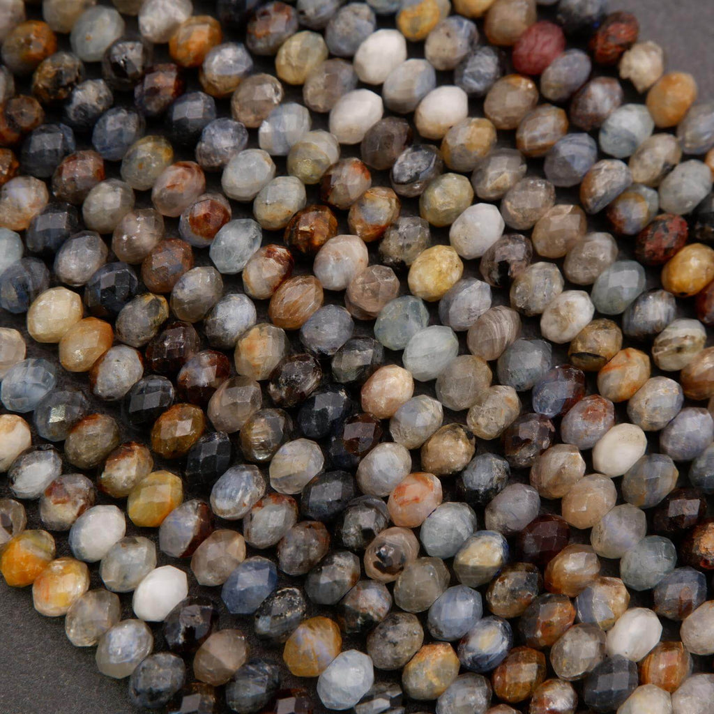 Close-up of multicolored gemstones on a dark background
