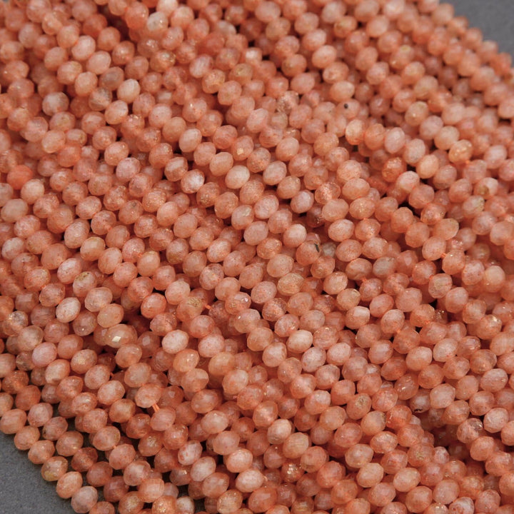 Close-up of pinkish-beige beads on a gray background