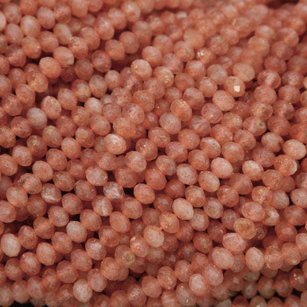 Close-up of pinkish-orange beads