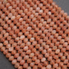 Close-up of pinkish-orange beads on a gray background