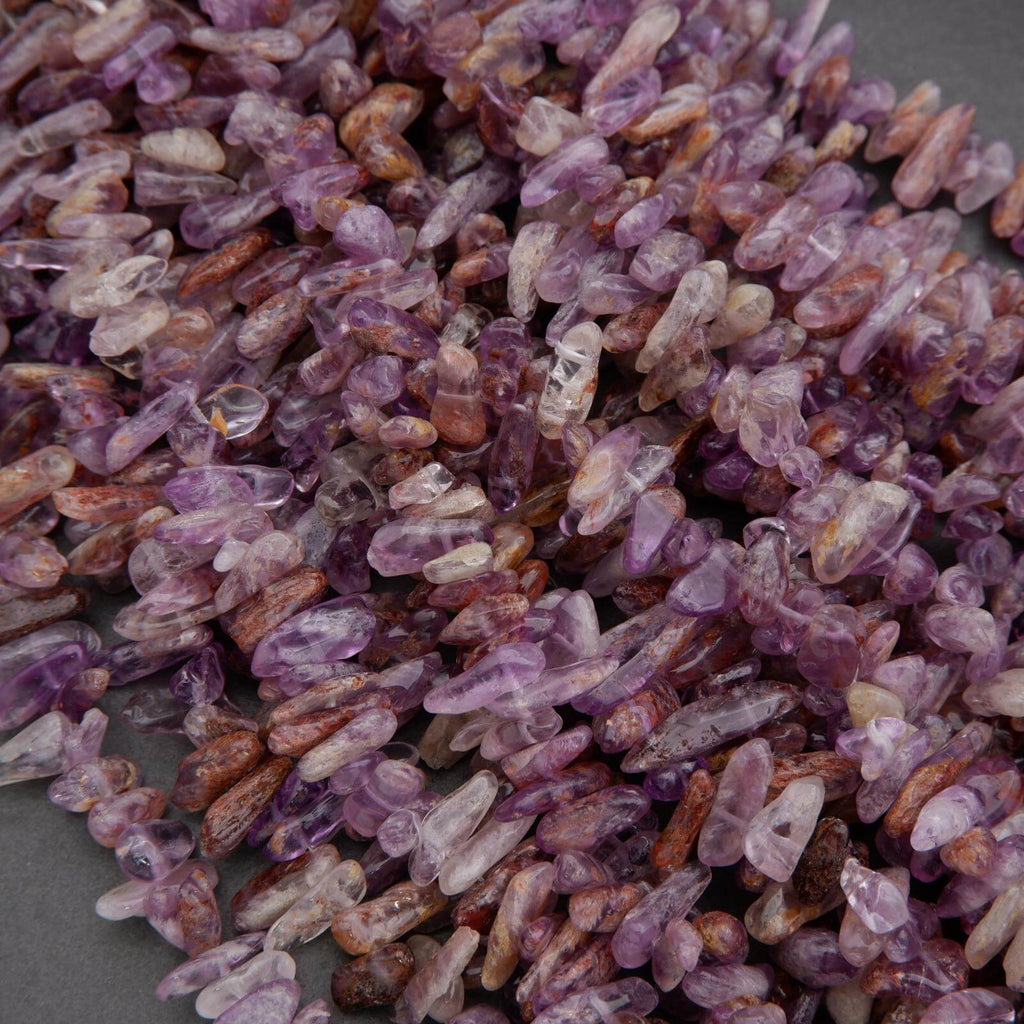 Close-up of purple and brown gemstones on a gray background