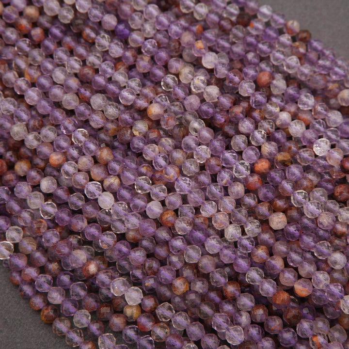 Close-up of purple and brown beads on a gray background