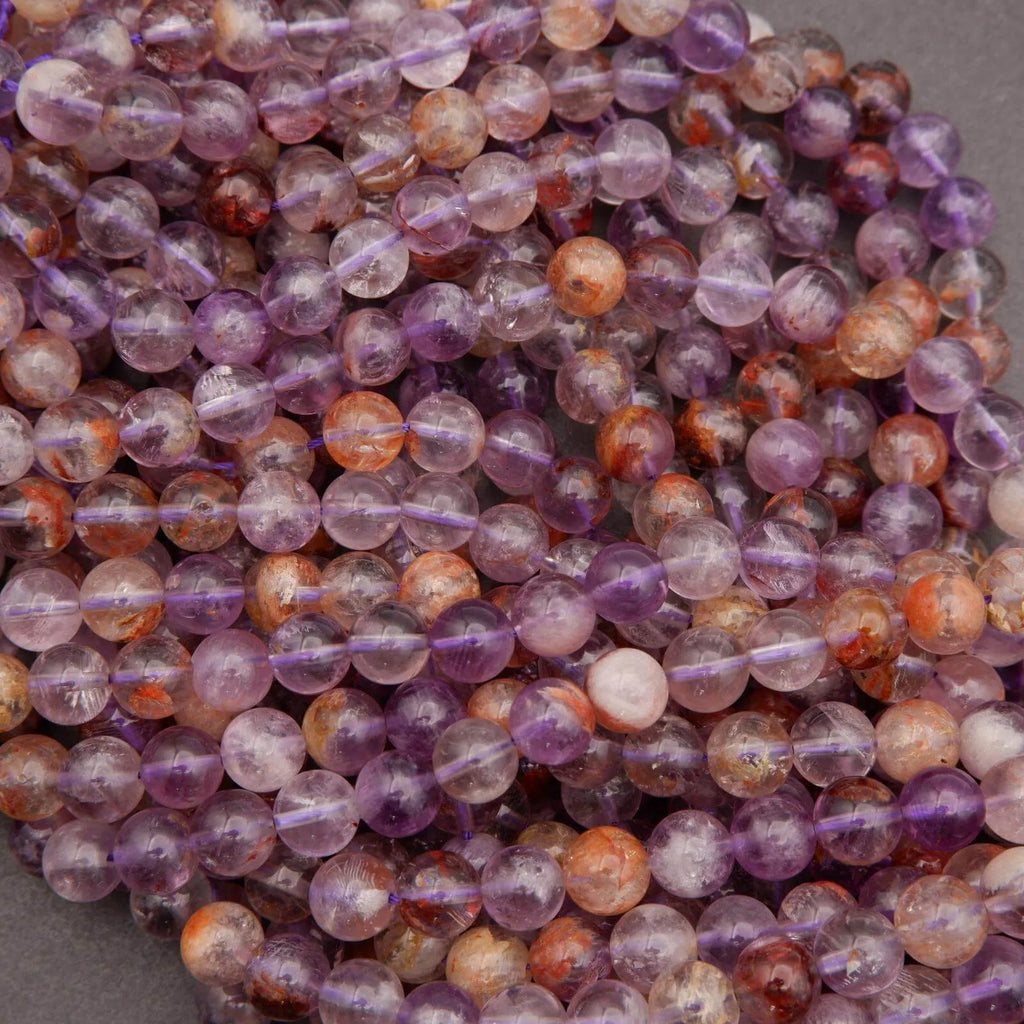 Close-up of multicolored beads on a gray background