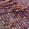 Close-up of multicolored beads on a gray surface