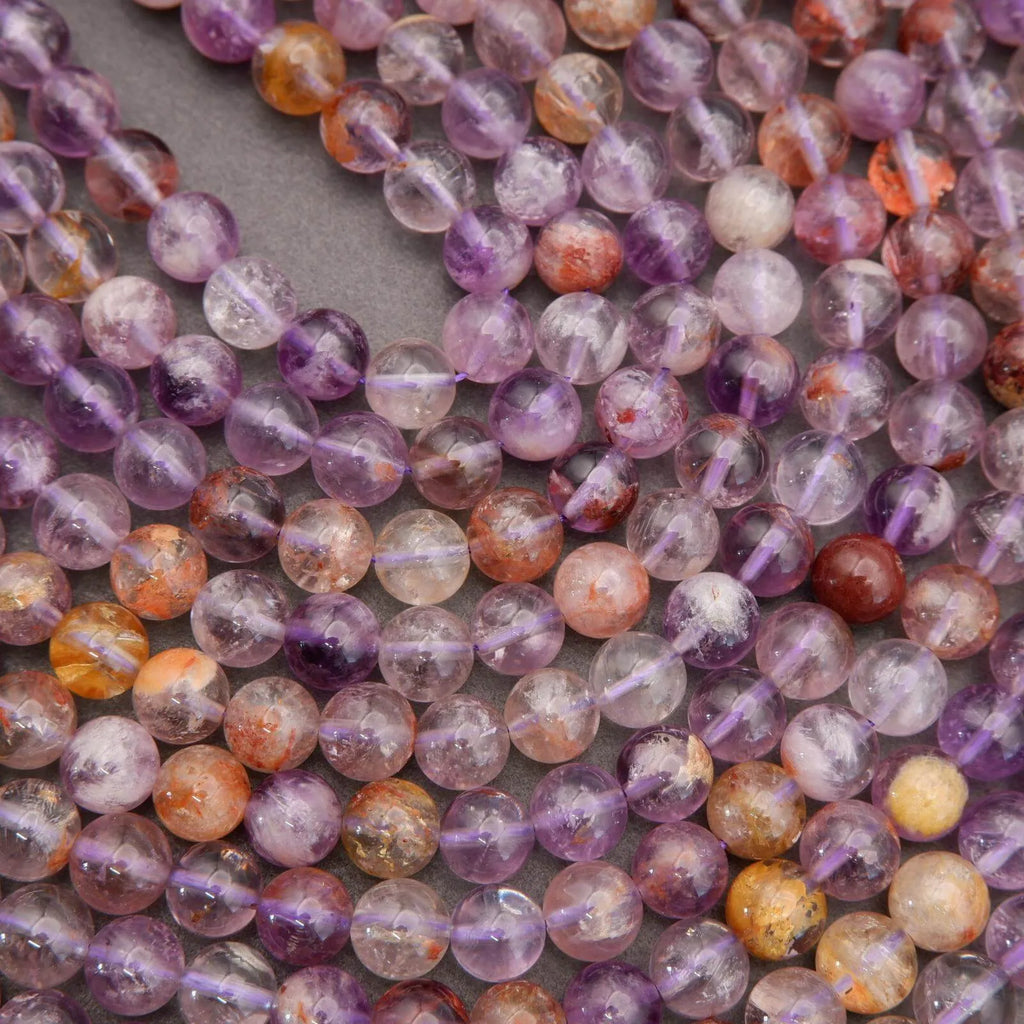 Close-up of multicolored gemstone beads on a dark background