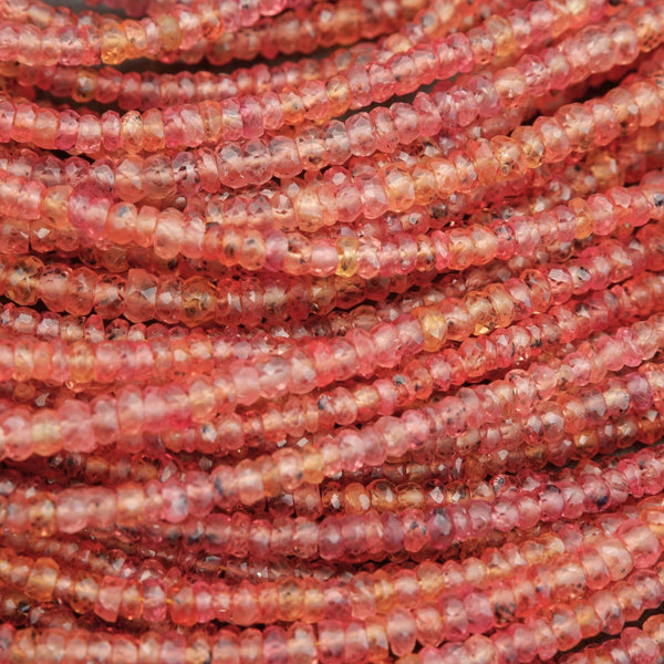 Orange faceted rodelle beads.