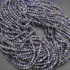 String of blue beads on a gray background