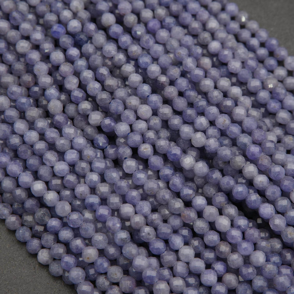 Close-up of purple beads on a dark surface