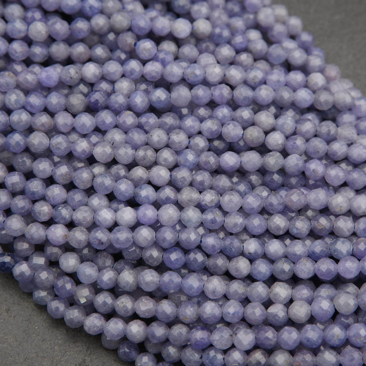 Close-up of purple beads on a dark surface