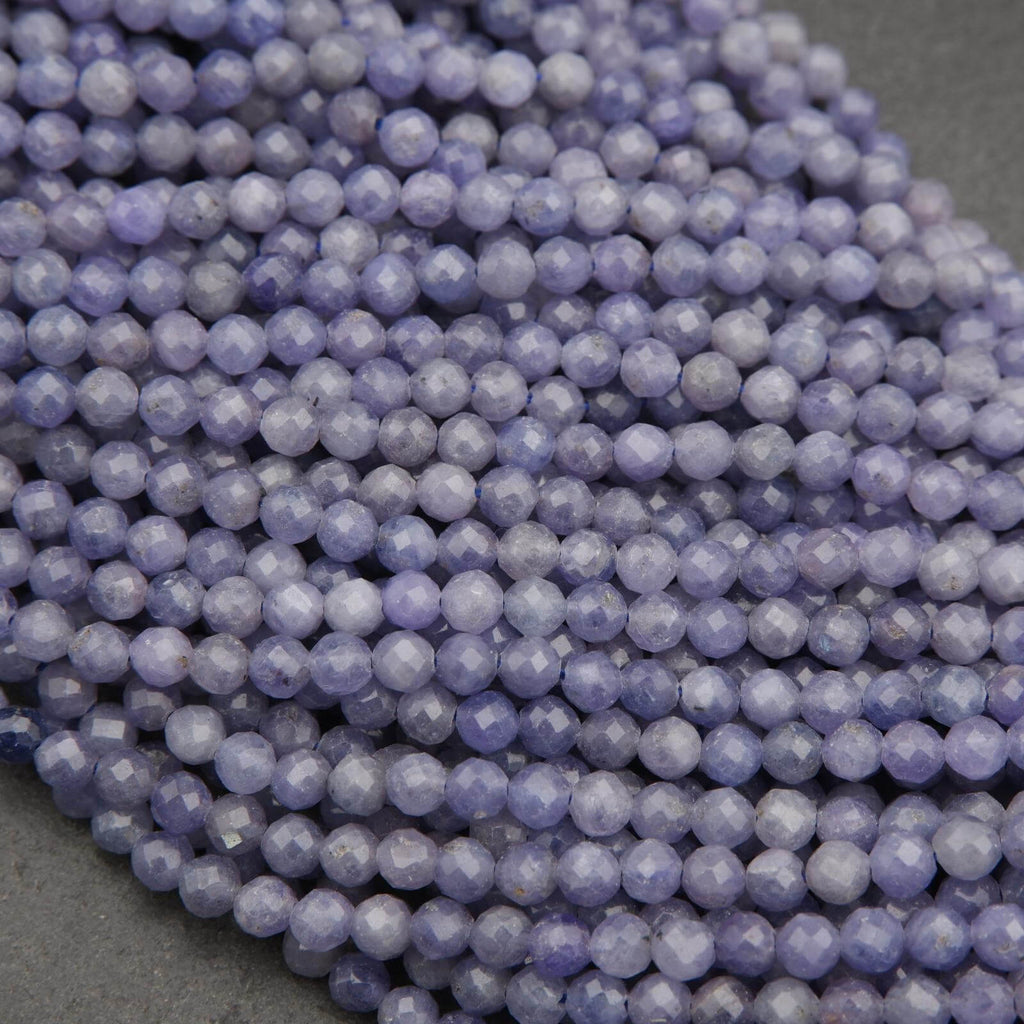 Close-up of purple beads on a dark surface