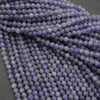 Close-up of purple beads on a dark background