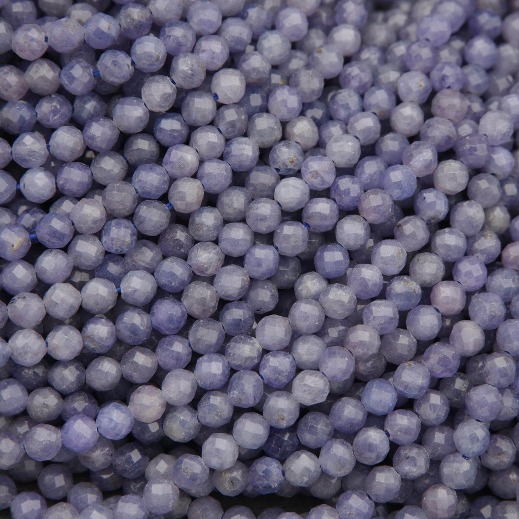 Close-up of purple beads with a dark background