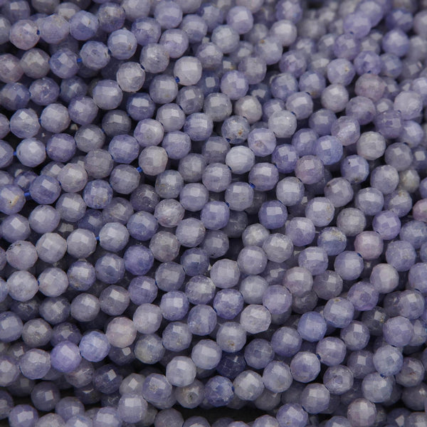 Close-up of purple beads with a dark background