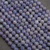 Close-up of purple beads on a dark background