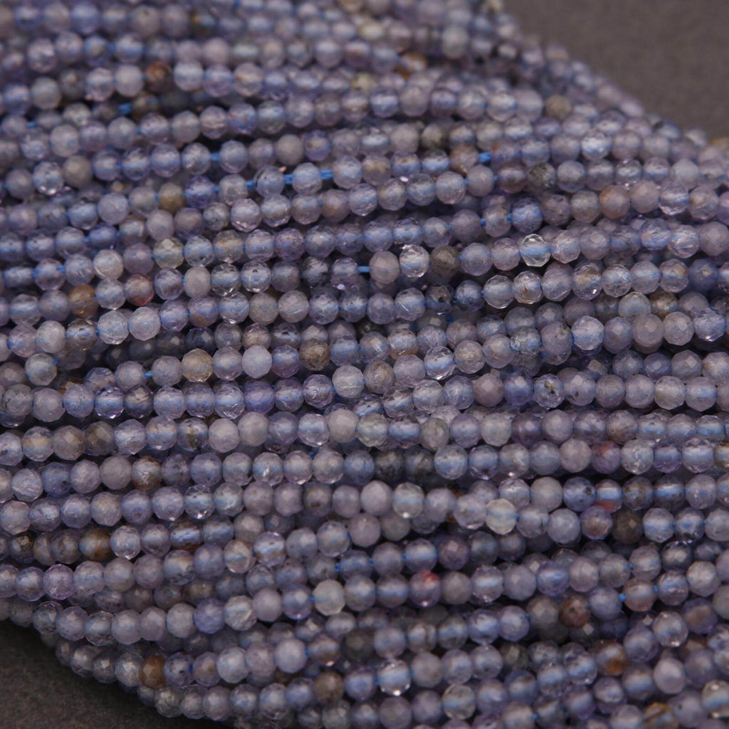 Close-up of a string of blue beads on a dark background