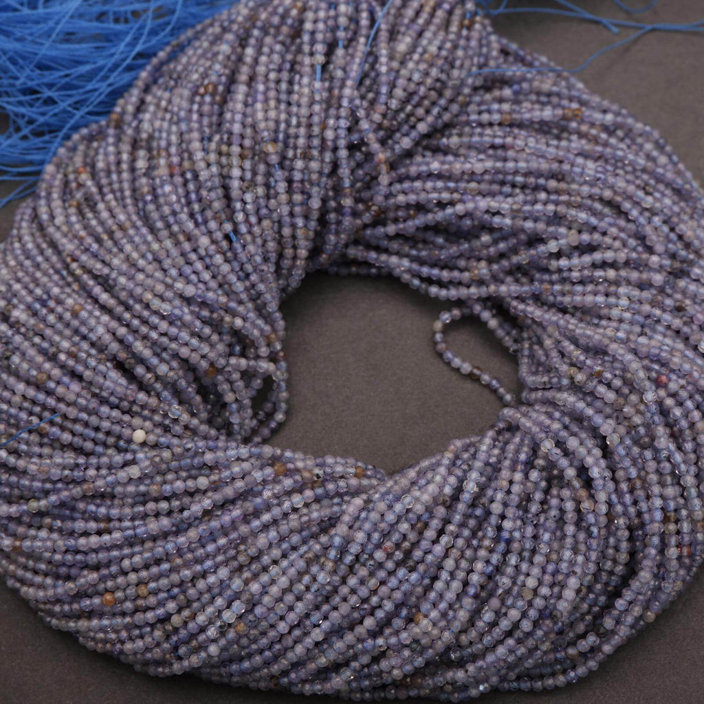 Coiled blue yarn on a dark surface
