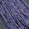 Close-up of purple beads on a gray background