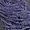 Close-up of purple beads on a dark background