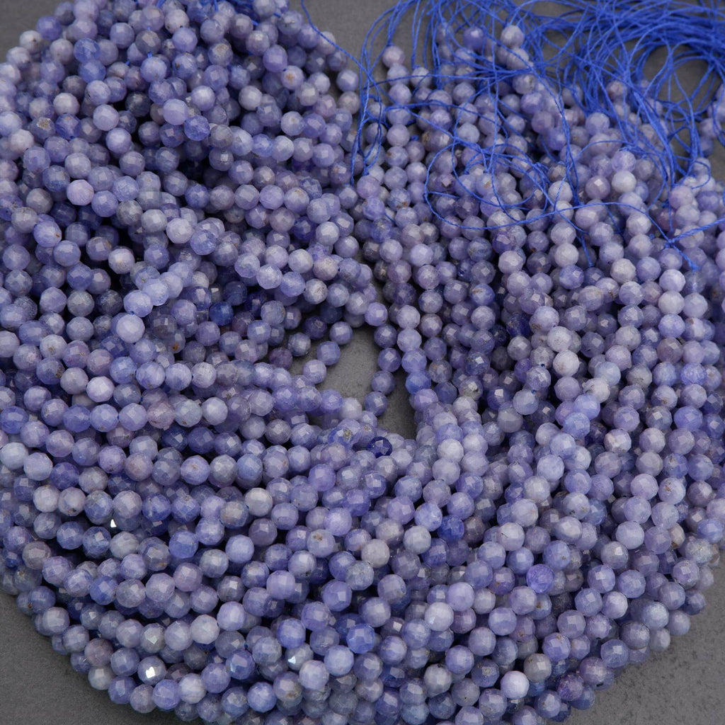 String of purple beads on a gray background