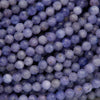 Close-up of purple beads with a blurred background