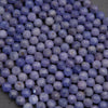 Close-up of purple beads on a dark background