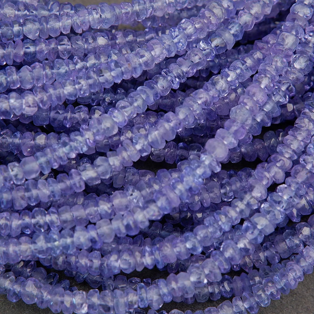 Close-up of a string of purple beads on a dark background