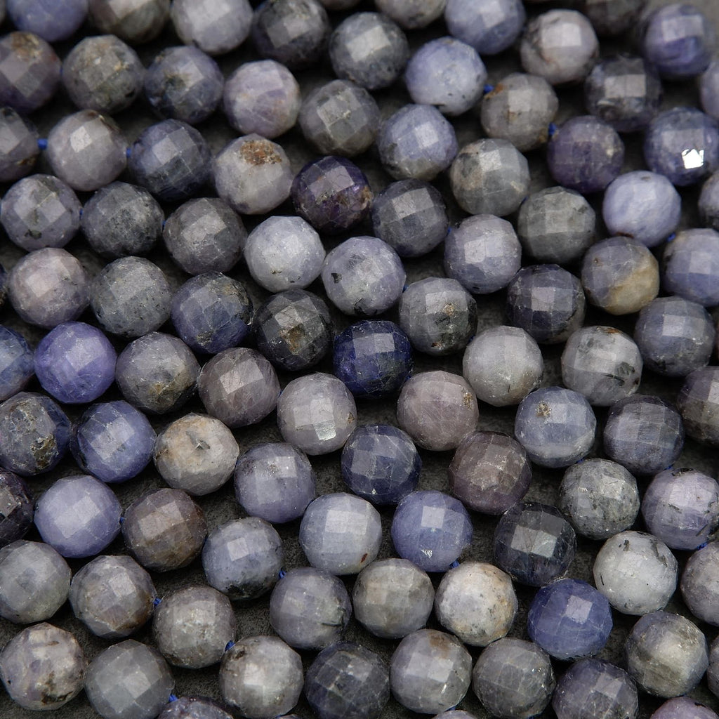 Faceted tanzanite beads showing natural tonal depth