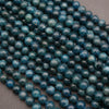 Close-up of blue beads on a dark background