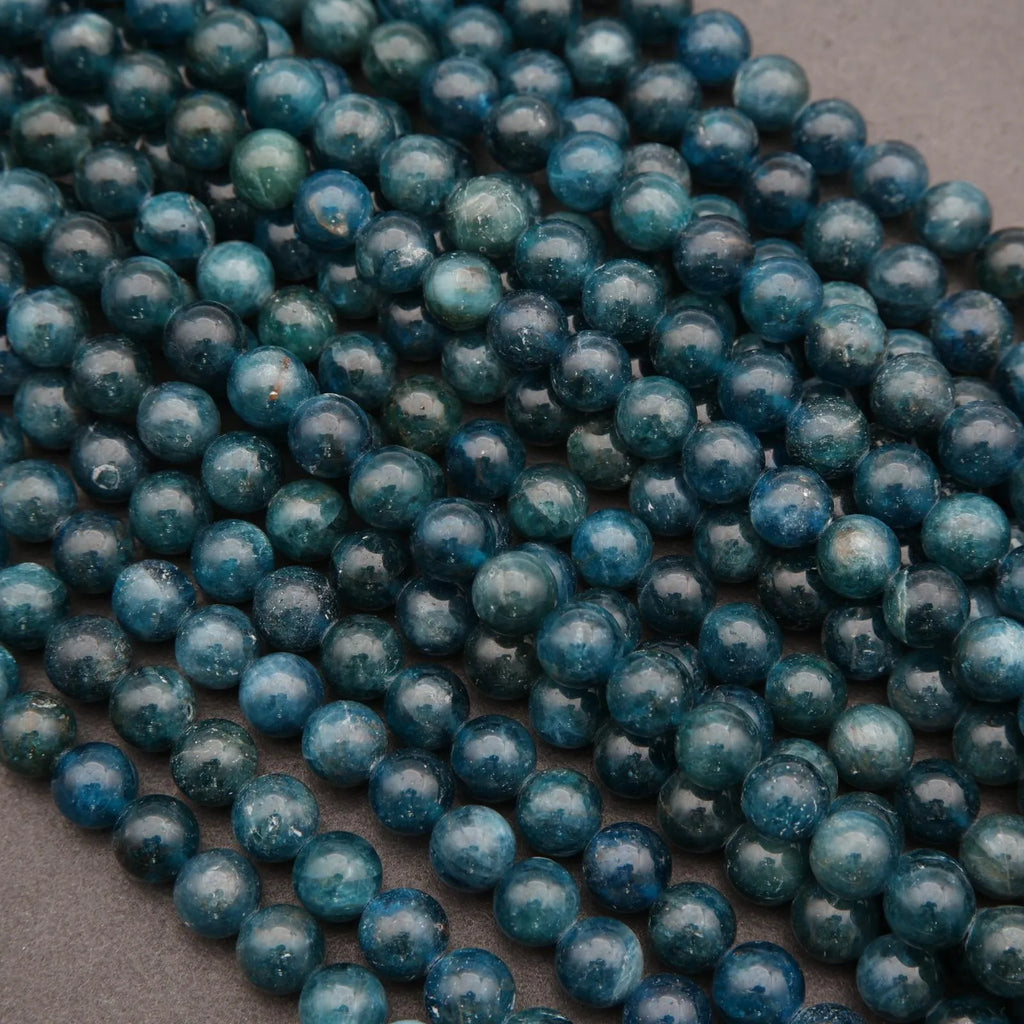 Close-up of blue beads on a dark background