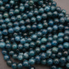 Close-up of blue beads on a dark background