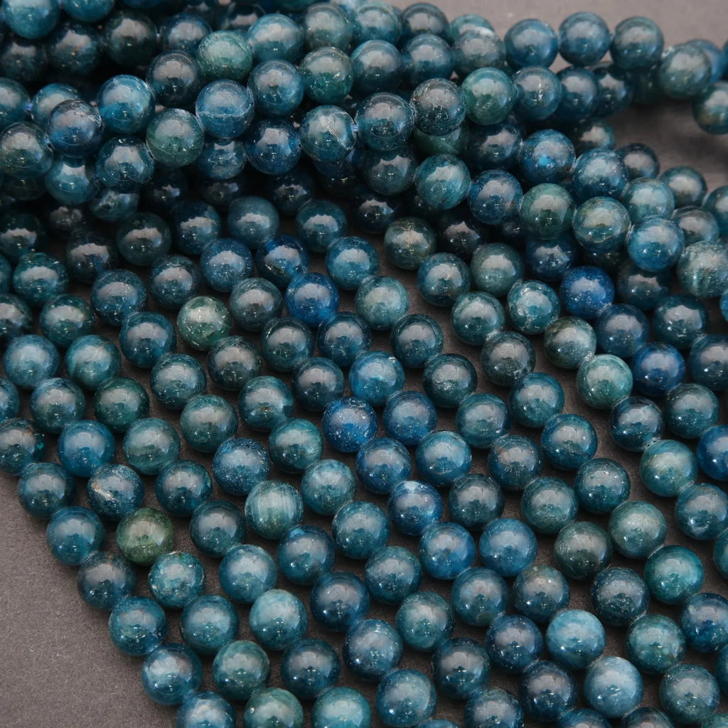 Close-up of blue beads on a gray background