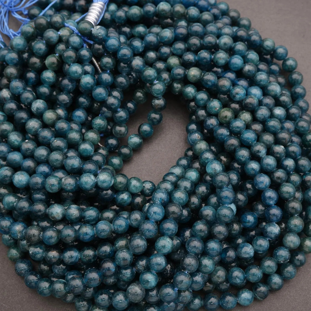String of blue beads on a gray background