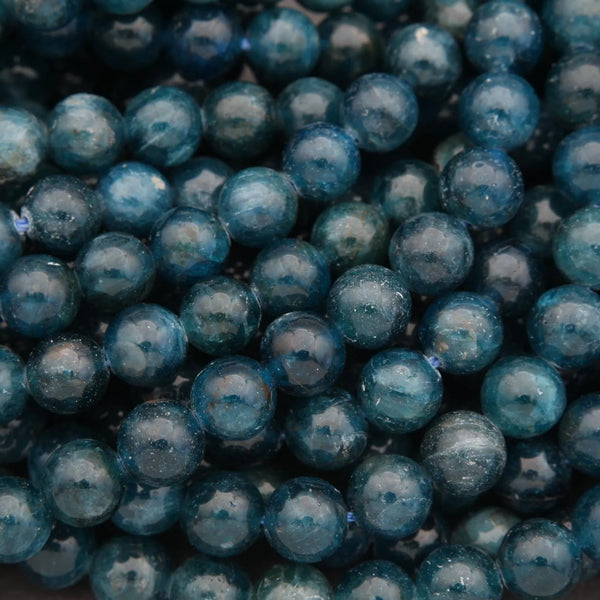 Close-up of blue beads with a dark background