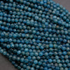 Close-up of blue beads on a dark background