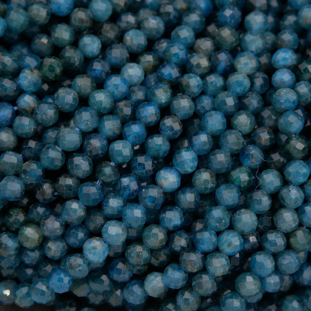Close-up of blue beads with a dark background